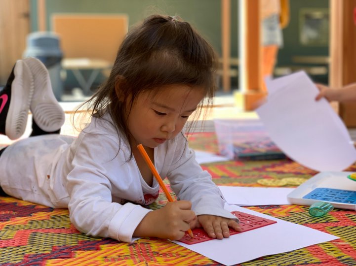ES Preschool girl traces letters