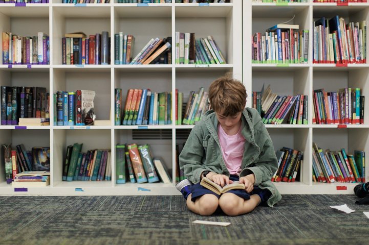 ES boy reading in library