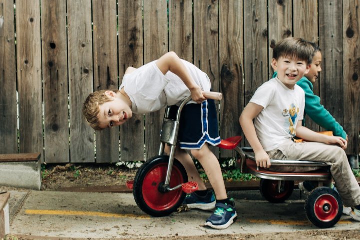 ES tricycle wagon students play yard