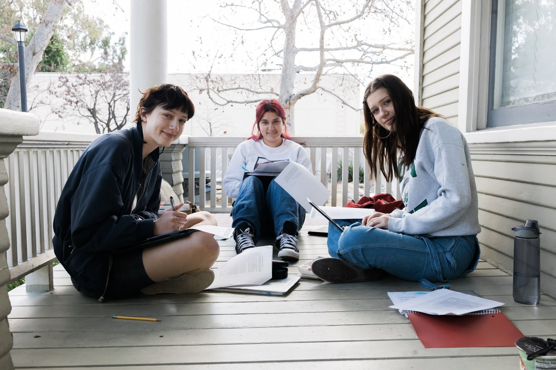 HS bungalow porch students studying smile