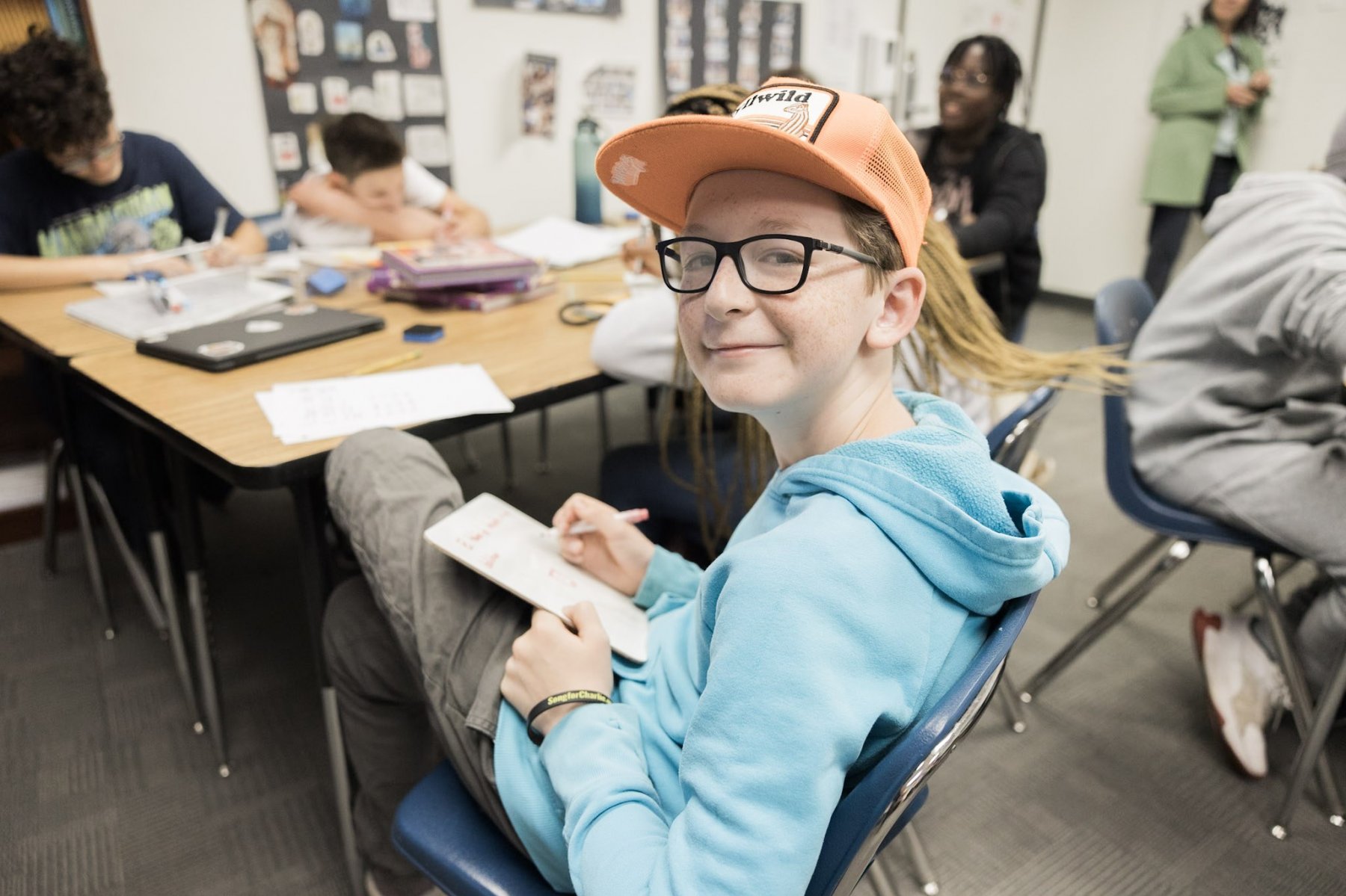 MS student smile classroom orange hat